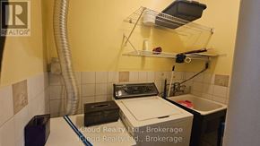 Toronto (Wexford-Maryvale) apartment for rent - A small laundry room with a washer and dryer.