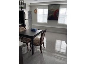 Vancouver apartment for rent - A dining room with a table and chairs.
