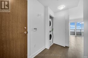 Toronto (Mimico) condo for rent - A brokerage sign is on the door of a home.