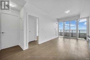 Toronto (Mimico) condo for rent - A spacious room with a view of the sky through the windows.