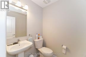 Ottawa townhouse for rent - A white sink and toilet in a small bathroom.