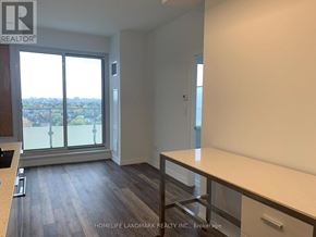 Toronto (Willowdale West) condo for rent - A room with a large window and a view of the city.