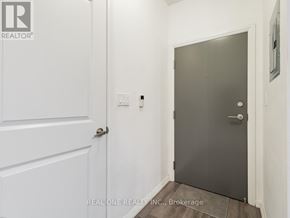 Toronto (Church-Yonge Corridor) condo for rent - A hallway with a white door and a grey door.