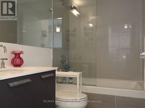 Toronto (Church-Yonge Corridor) condo for rent - A bathroom with a glass shower stall and a white toilet.