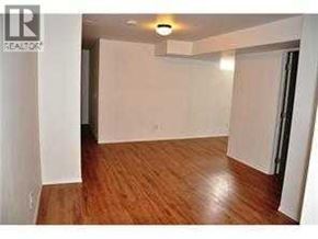 Calgary apartment for rent - A room with wooden flooring and white walls.