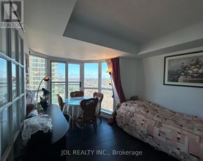 Toronto (Rosedale-Moore Park) condo for rent - A bedroom with a bed, table, chairs and a view of the city.