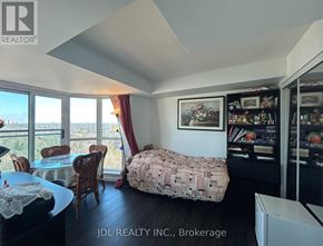 Toronto (Rosedale-Moore Park) condo for rent - A bedroom with a bed covered in a blanket that has a pattern of money on it.