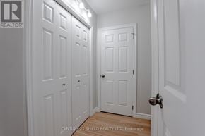 North Stormont fourplex for rent - A hallway with white doors and a wooden floor.