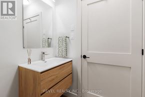 Lincoln (Beamsville) condo for rent - A bathroom with a sink, mirror, and towel rack.