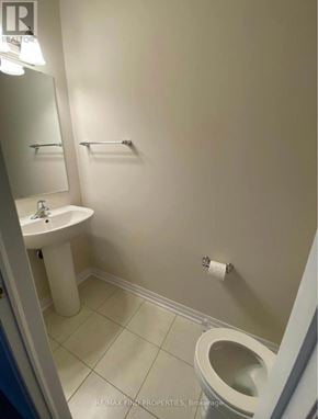 Kitchener townhouse for rent - A white sink and toilet in a small bathroom.