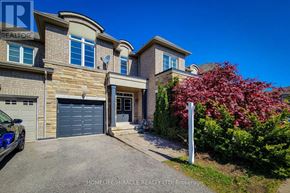 Oakville (Wm Westmount) townhouse for rent - A house with a car parked in front and a sign that says "HOMELIFE/MIRACLE REALTY LTD, Brokerage".