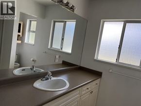 Richmond apartment for rent - A bathroom with two sinks and a large mirror.