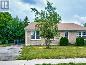Toronto (Malvern) apartment for rent - A house with a brown roof and a tree in front of it.
