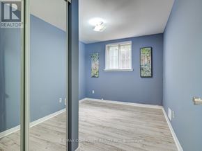 Toronto (Malvern) apartment for rent - A room with blue walls and a window.