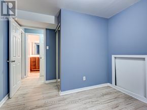 Toronto (Malvern) apartment for rent - A room with blue walls and wooden flooring.
