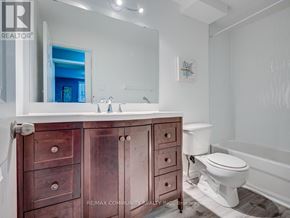 Toronto (Malvern) apartment for rent - A bathroom with a white counter top and a brown cabinet.
