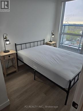 Toronto (Centennial Scarborough) condo for rent - A kitchen with wooden cabinets and a stove top oven.