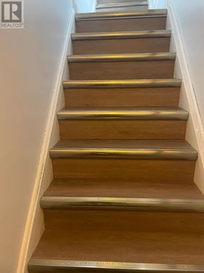 Richmond Hill (Crosby) apartment for rent - A set of wooden stairs with metal handrails.