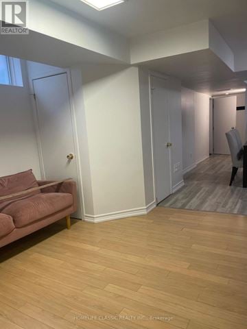 Richmond Hill (Crosby) apartment for rent - A living room with a couch and a chair.