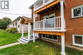 Brantford apartment for rent - A house with a balcony and a REALTOR® logo.