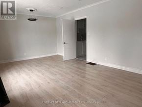 Bradford West Gwillimbury (Bradford) apartment for rent - A room with a white door and a light fixture on the ceiling.