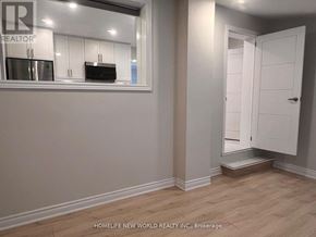 Bradford West Gwillimbury (Bradford) apartment for rent - A white door is open to a hallway.