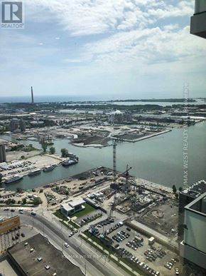Toronto (Waterfront Communities) condo for rent - A view from a high vantage point looking down at a busy marina with boats and yachts.