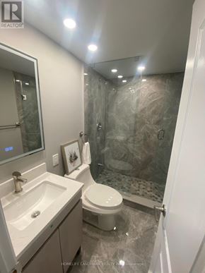 Markham (Village Green-South Unionville) apartment for rent - A bathroom with a toilet, sink, and shower.