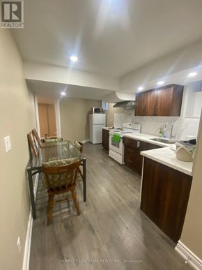 Markham (Village Green-South Unionville) apartment for rent - A kitchen with a table and chairs in it.