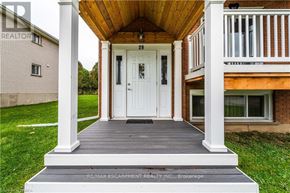 Brantford duplex for rent - A white door is on the porch of a house.