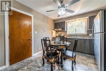 Brantford duplex for rent - A kitchen with a table and chairs in the middle of the room.