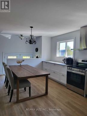 Oshawa (Donevan) apartment for rent - A dining room with a wooden table and chairs.