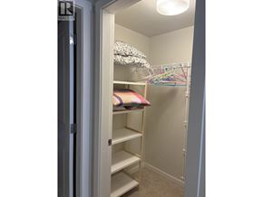 Richmond apartment for rent - A white closet with a shelf and a pillow on it.