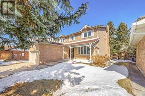 Markham (Aileen-Willowbrook) apartment for rent - A house with a snow-covered front yard.