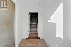 Niagara-On-The-Lake (Town) apartment for rent - A hallway with a staircase leading to the second floor.