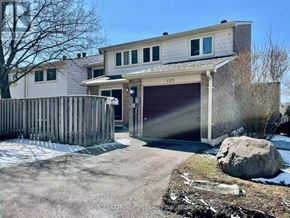 Toronto (Don Valley Village) townhouse for rent - A two-story house with a garage and a driveway.