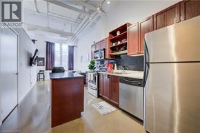 Kitchener condo for rent - A kitchen with a refrigerator on the right side.