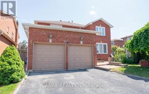 Markham (Village Green-South Unionville) apartment for rent - A house with a brick facade and a large garage door is for sale through Anjia Realty in Brokerage.