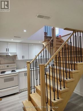 Markham (Markville) apartment for rent - A staircase with a black railing and wooden steps.