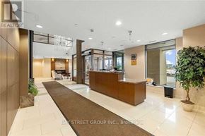 Richmond Hill (Beaver Creek Business Park) condo for rent - A reception area with a brown carpet and a wooden reception desk.