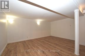 Newmarket (Bristol-London) apartment for rent - A room with wooden flooring and white walls, with a light fixture on the ceiling.