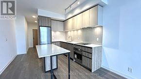 Vaughan (Beverley Glen) condo for rent - A modern kitchen with a table and chairs.