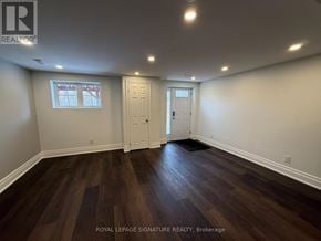 Milton (Fo Ford) apartment for rent - A room with wooden floors and white walls.