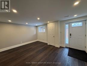 Milton (Fo Ford) apartment for rent - A room with wooden flooring and white walls.