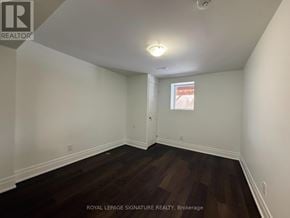 Milton (Fo Ford) apartment for rent - A room with wooden floors and white walls.