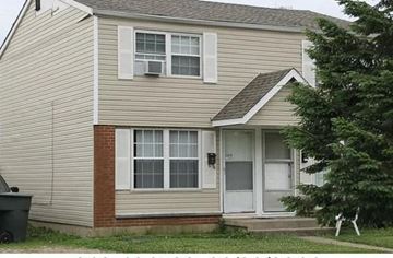 Columbus apartment for rent - A house with a brown and beige exterior and a white door.