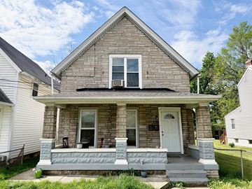 Louisville apartment for rent - A house with a white door and a porch.