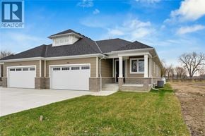 Amherstburg apartment for rent - A house with a grey roof and a white garage door.