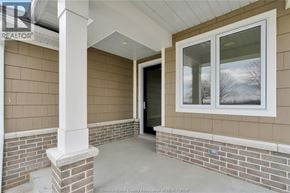 Amherstburg apartment for rent - A house entrance with a glass door and a window.