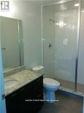 Toronto (Willowdale East) condo for rent - A bathroom with a toilet, sink, and shower.